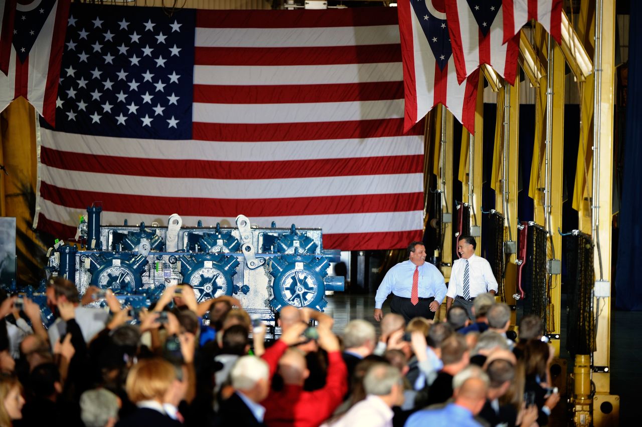 Christie, left, and Romney walk up to the stage at Ariel Corporation in Mount Vernon, Ohio, on Wednesday.