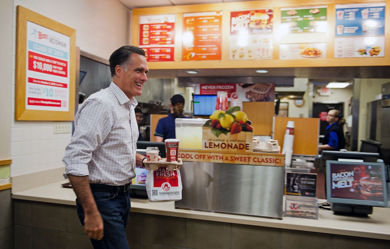 Republican presidential candidate Mitt Romney departs a Wendy's restaurant with his dinner order in Cuyahoga Falls, Ohio, on Tuesday. 