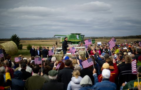 Supporters cheer as Romney delivers remarks on the James Koch Farm in Van Meter, Iowa, on Tuesday.