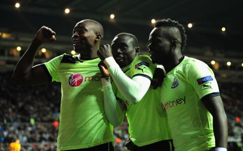 Newcastle's Ivory Coast international Cheick Tiote (right) will be up against his club teammate Papiss Cisse (left) of Senegal on Saturday in the second-leg playoff.