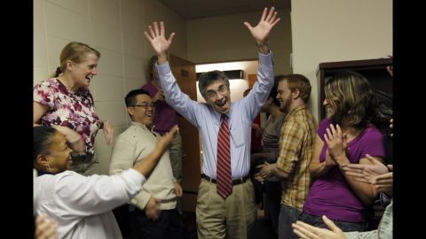 Robert Lefkowitz, center, enters a party held for him at Duke University after winning the Nobel Prize in chemistry on Wednesday. Lefkowitz shares the prize with his former student, Brian Kobilka.