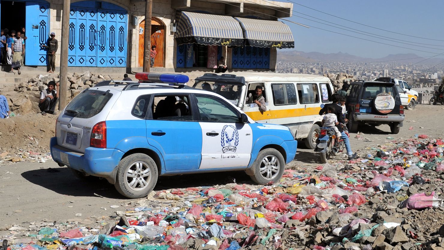 A police car is parked at the scene where unidentified gunmen shot dead a senior Yemeni security official. 