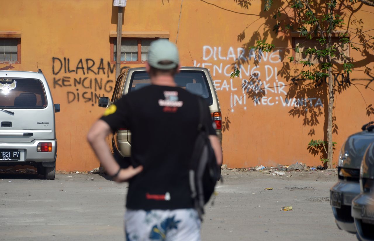 Words spray-painted on the side of a wall near the Sari Club bomb site read in Indonesian "don't urinate here." Campaigners are fighting for a permanent memorial to be build on the site, a peace park to allow for quiet reflection, but negotiations have been delayed over price.
