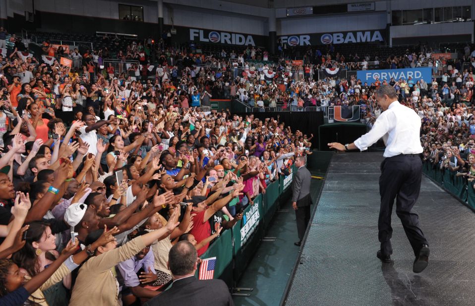 Obama greets supporters at a campaign rally at the University of Miami on Thursday.