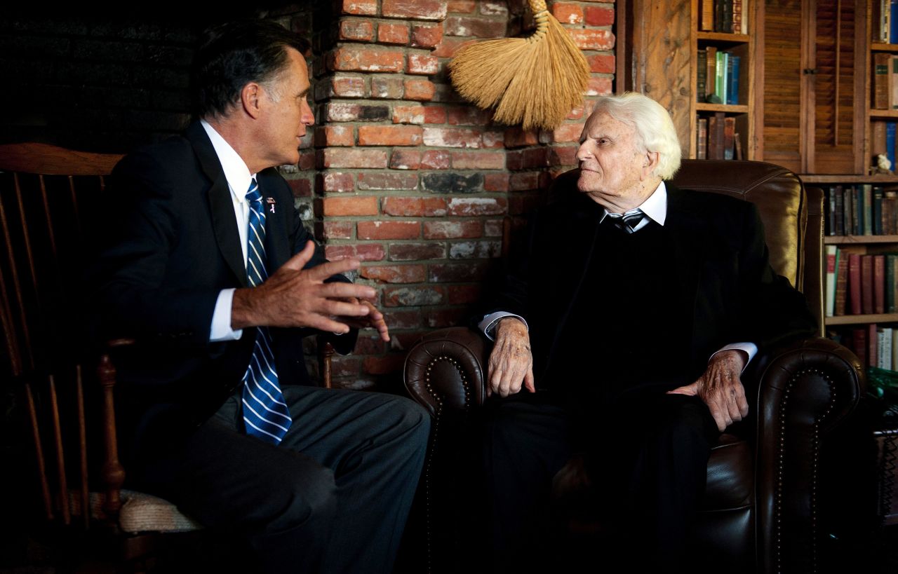 Romney, left, speaks with the Rev. Billy Graham during a visit to the Graham cabin in Montreat, North Carolina, on Thursday.