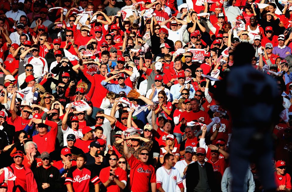 Cincinnati Reds fans cheer in the ninth inning as San Francisco's Sergio Romo waits to pitch. Cincinnati scored a run in the ninth but it wasn't enough as the Giants won the game and the series. 