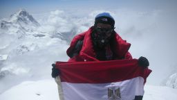 Omar Samra is an Egyptian explorer and the youngest Arab ever to climb Mount Everest. Here he poses with his country's national flag atop the world's highest peak.