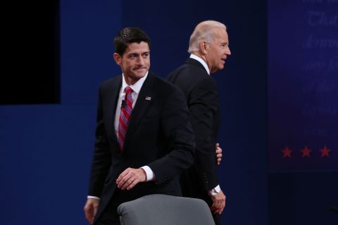 Vice President Joe Biden and U.S. Rep. Paul Ryan walk off stage after the vice presidential debate.