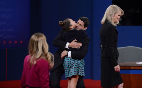 Vice presidential candidate Ryan greets family following his debate with Vice President Biden.