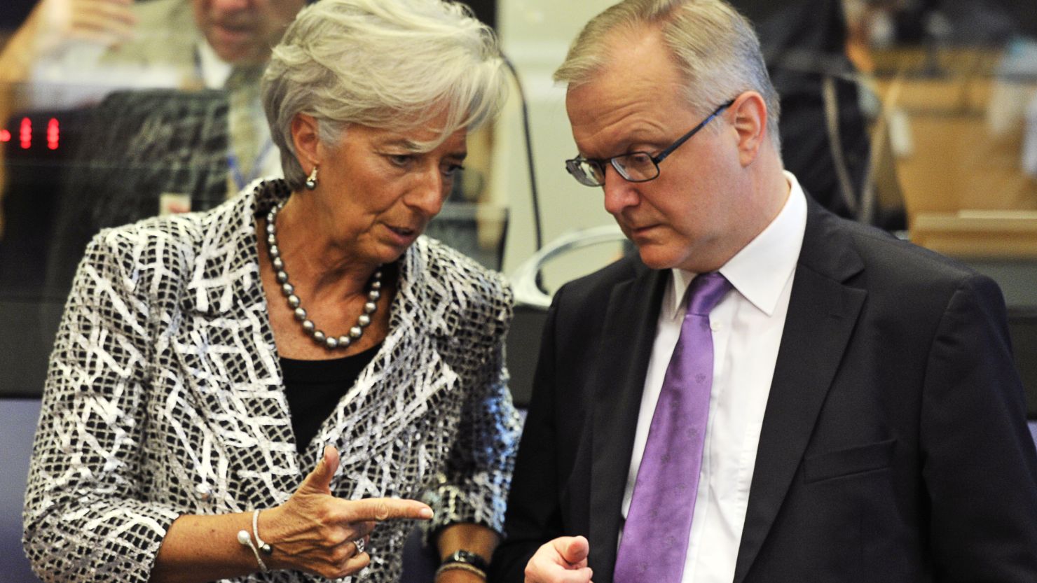 International Monetary Fund Managing Director Christine Lagarde and EU Commissioner Olli Rehn before an Eurozone Council meeting in June.