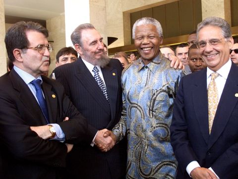 Castro puts his arm around South African President Nelson Mandela in May 1998 with Italian Prime Minister Romano Prodi, left, and Brazilian President Fernando Henrique Cardoso. They were in Geneva, Switzerland, for a conference of the World Trade Organization.