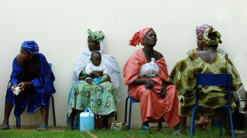 Women wait for the start of a gathering on women's rights in Bamako, Mali. The U.N. voiced fears over women's rights.