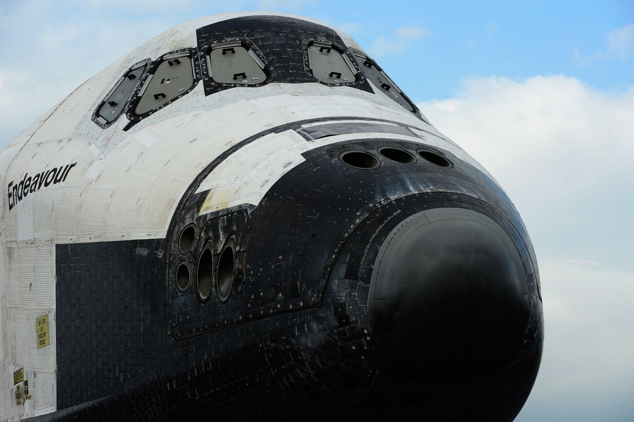 The space shuttle Endeavour is parked in a mall parking lot on its way to the California Science Center.