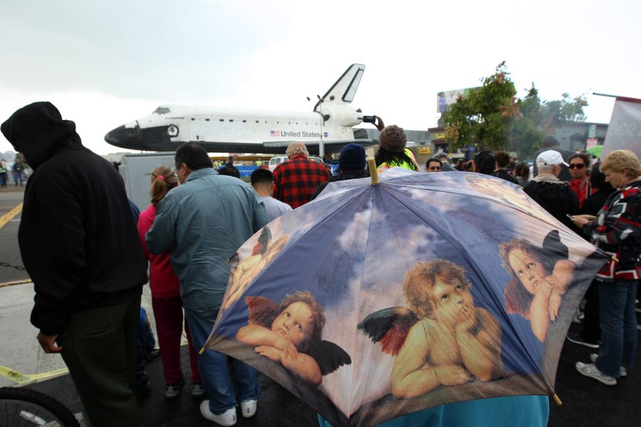 People get a close view of the space shuttle Endeavour in a misty rain during a break in its journey on Friday.