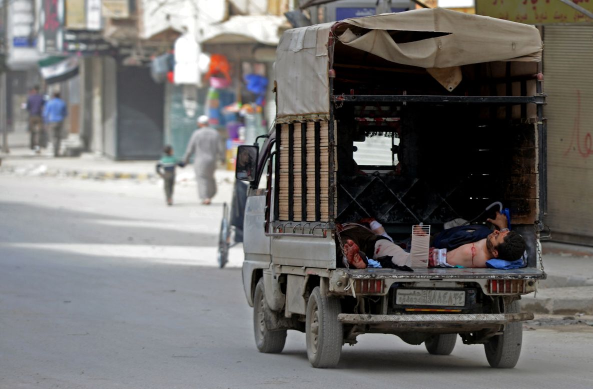 Bodies of Syrian civilians lie in the back of a truck outside a hospital following shelling by Syrian government forces during clashes with opposition fighters in Aleppo on Thursday.