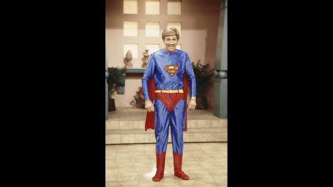 Collins poses in a Superman costume during the taping of "Hour Magazine" in 1987 in West Hollywood, California.