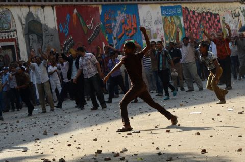  The health ministry said at least 12 people were wounded as protesters showered each other with stones after Morsy supporters tore down a podium from which anti-Brotherhood chants were being orchestrated.