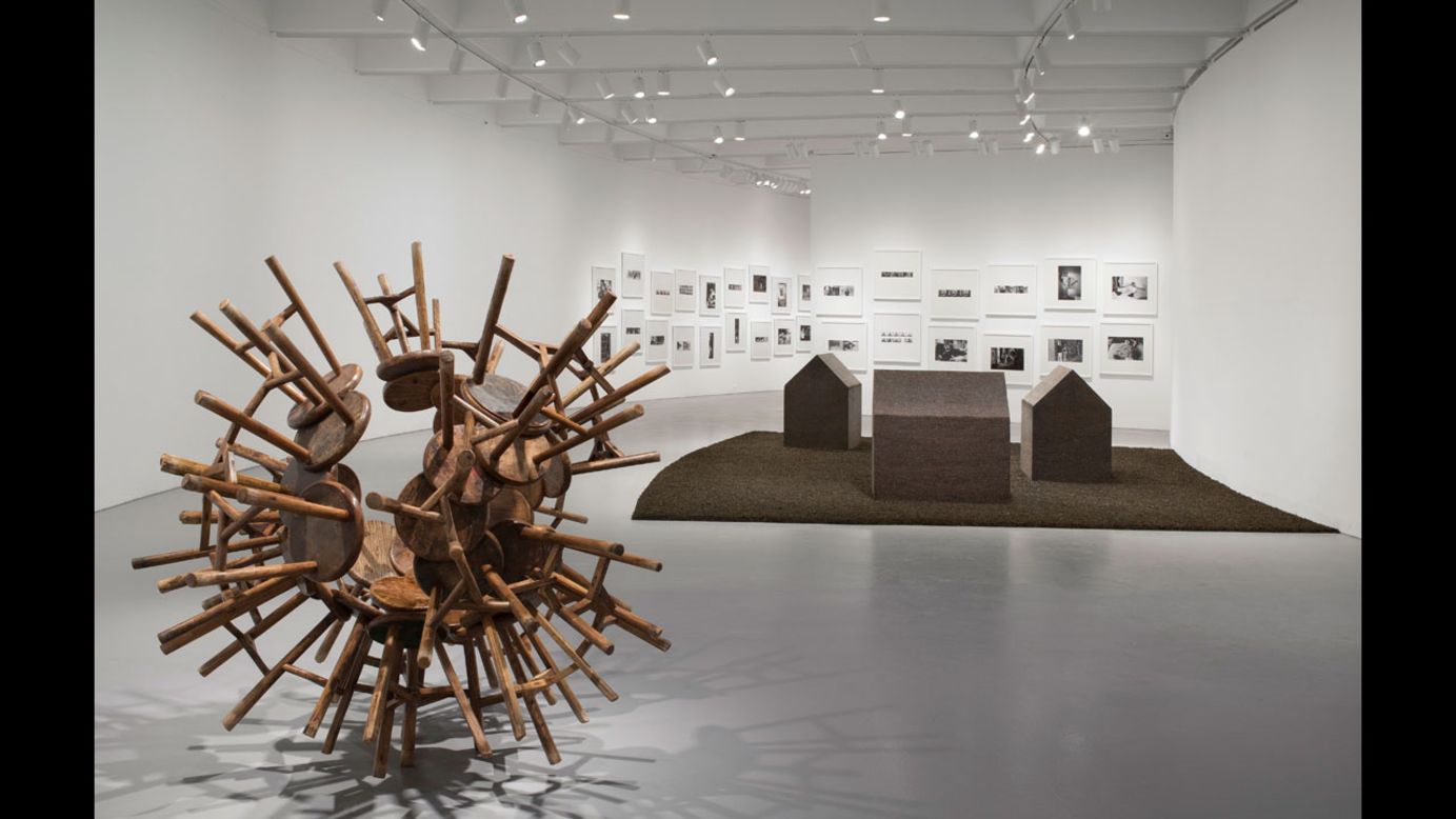 "Grapes" (2010), left, transforms Qing Dynasty-era stools into a new vision. In the background are "New York Photographs" (1983-1993), which documents Ai's years in the downtown scene, and "Tea House" (2009).