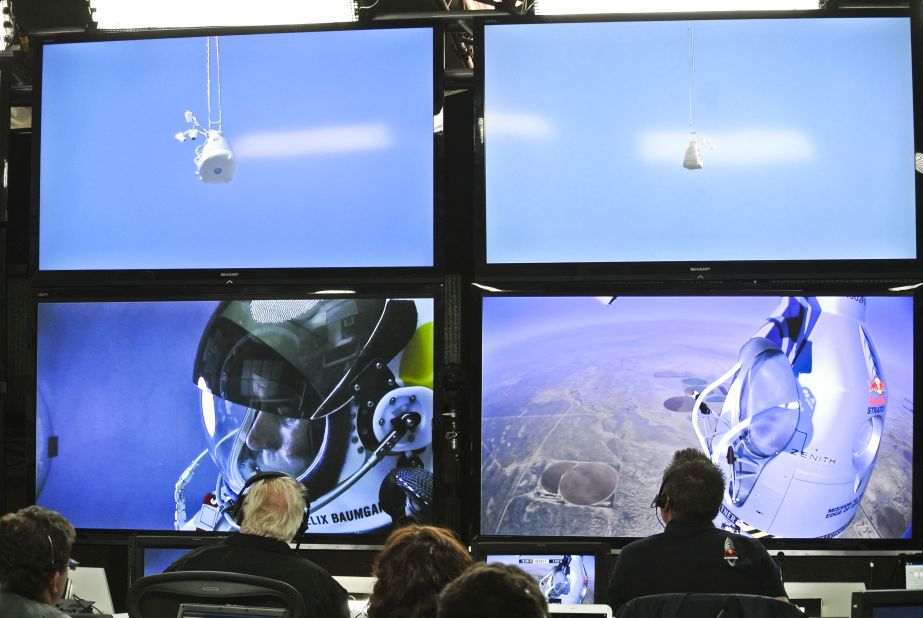 People at the mission control center in Roswell, New Mexico, watch Baumgartner during his ascent on Sunday.