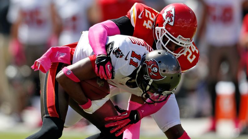 Brandon Flowers of Kansas City tackles Tampa Bay receiver Tiquan Underwood.