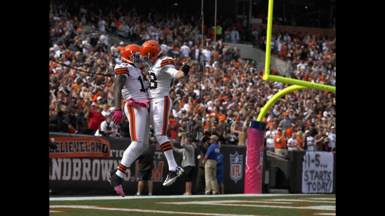 Cleveland's Josh Gordon, left, celebrates with a teammate after scoring a touchdown against Cincinnati.
