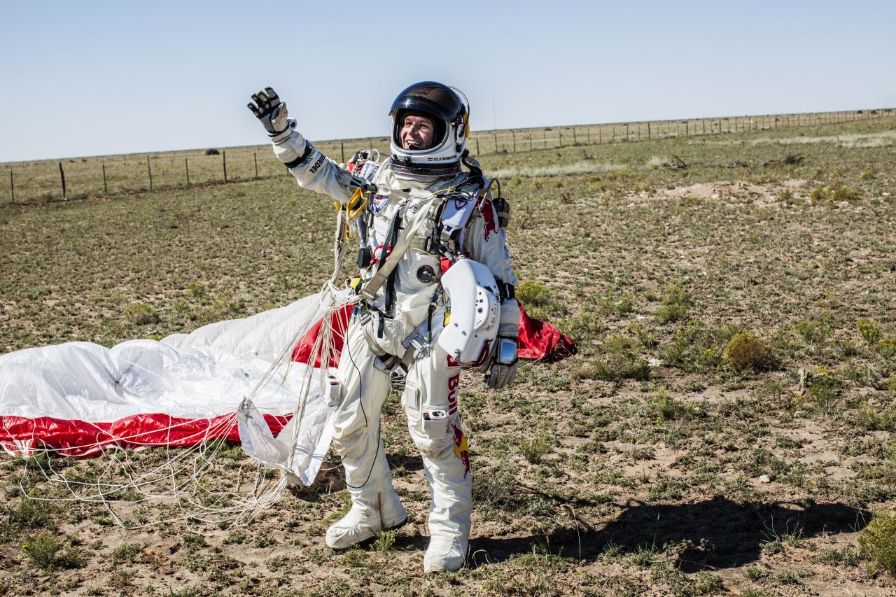 Baumgartner celebrates after successfully completing the final manned flight for Red Bull Stratos mission.