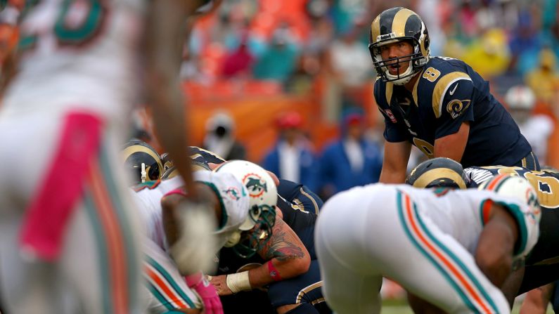 Rams quarterback Sam Bradford gets ready to take a snap Sunday against the Dolphins.