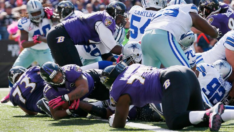 Running back Ray Rice of the Ravens rushes for a touchdown against the Cowboys.