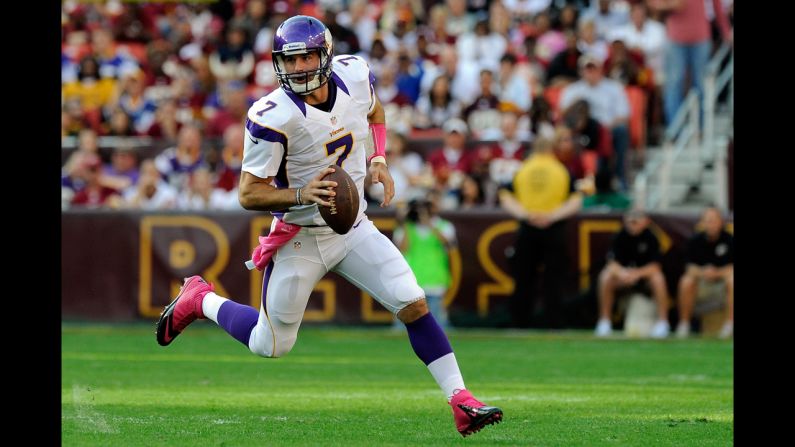 Vikings quarterback Christian Ponder scrambles with the ball during Sunday's game against the Redskins.