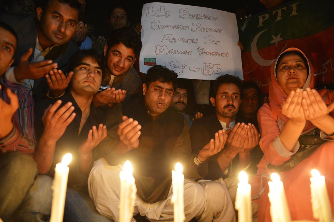 Supporters place candles to pay tribute to Malala in Islamabad on Wednesday.