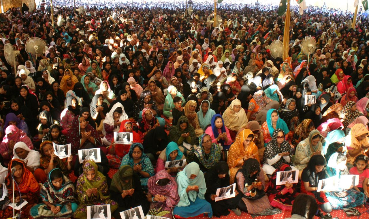Supporters hold portraits of Malala as they pray for her well-being in Karachi, Pakistan in 2012. Malala gained fame for blogging about how girls should have rights in Pakistan, including the right to learn. 