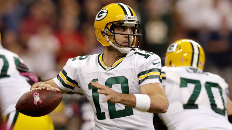 Packers quarterback Aaron Rodgers looks to pass during Sunday's game against the Texans.