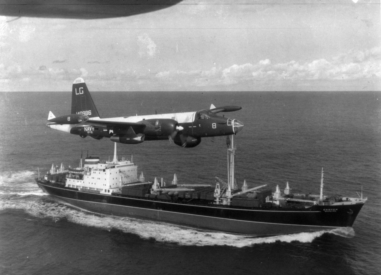 A P2V Neptune U.S. patrol plane flies over a Soviet freighter in 1962.