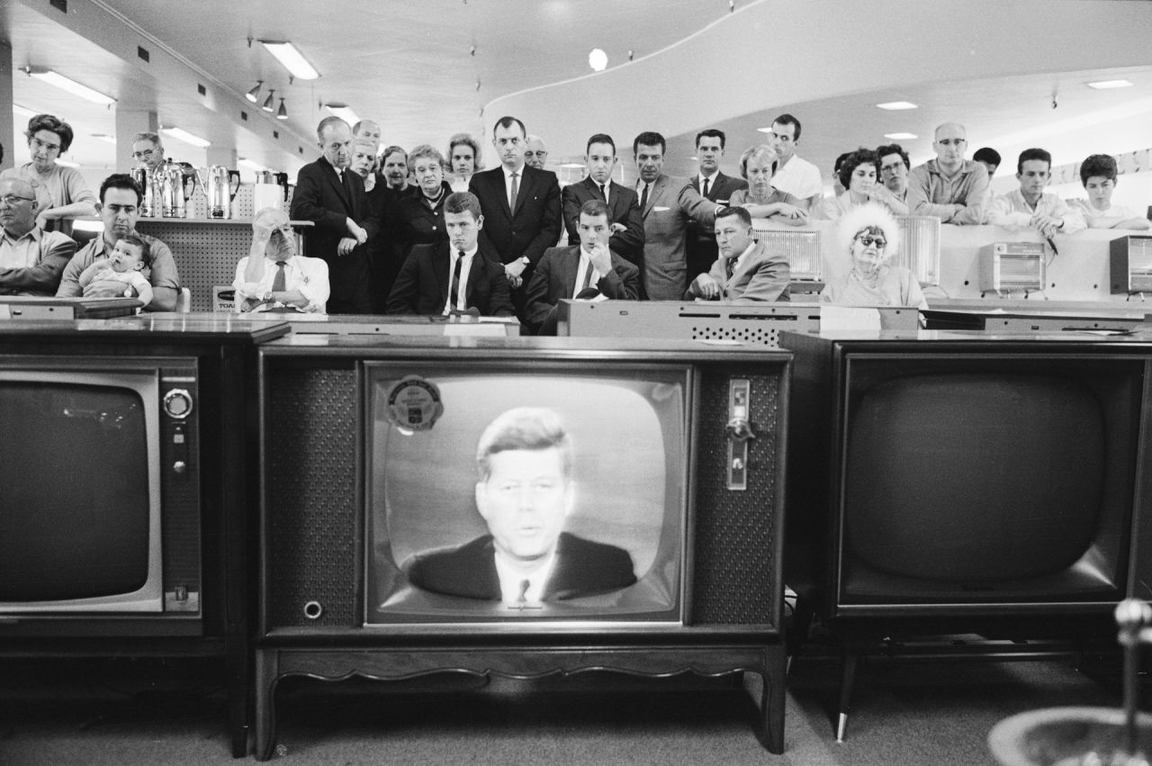 People gather in an electronics store to watch American President John F. Kennedy deliver a nationally televised address on the Cuban missile crisis on October 22, 1962.