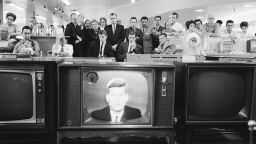 A group of cutomers in an unidentified store gather in the electronics department to watch American President John F. Kennedy as he delivers a televised address to the nation on the subject of the Cuban Missile Crisis on October 22, 1962.