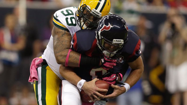Jerel Worthy of the Green Bay Packers sacks Houston Texans quarterback Matt Schaub in the first quarter.