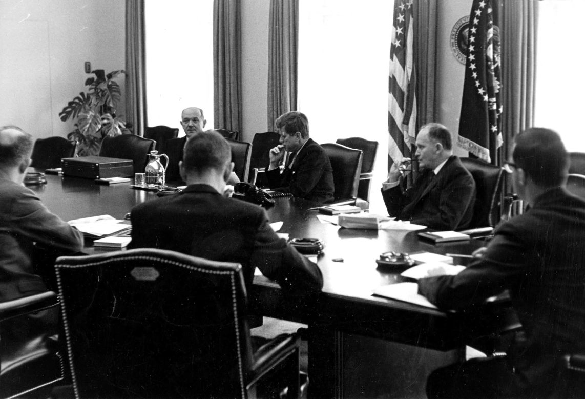 President John F. Kennedy meets with aides.