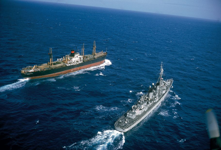 American destroyer USS Vesole (DD-878) escorts the Russian freighter Polzunov into international waters, bringing an end to the Cuban missile crisis in October 1962.