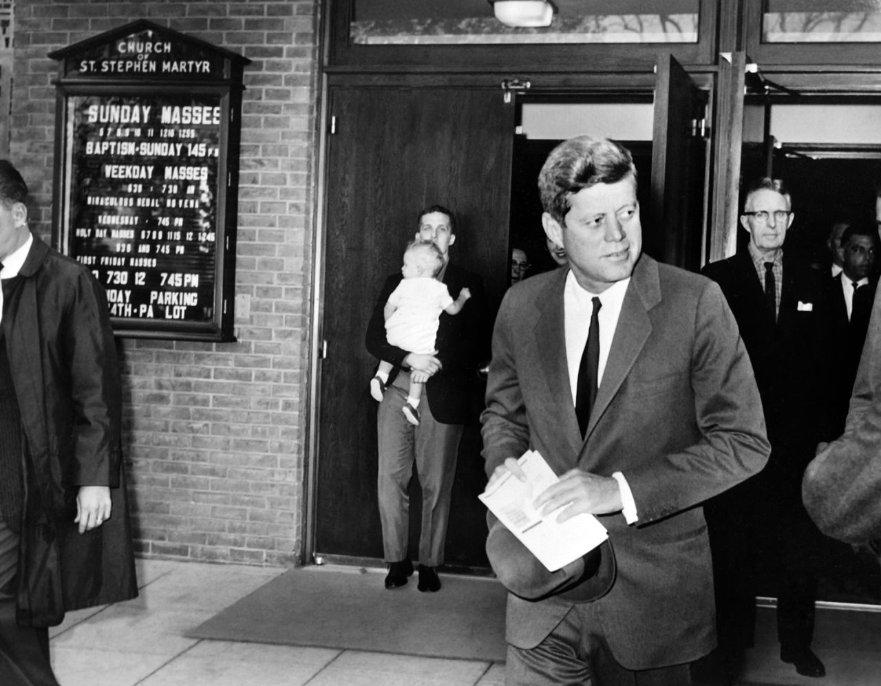 President John F. Kennedy leaves St. Stephen Martyr Catholic Church after attending mass on October 29, 1962, in Washington, just a few hours before the Cuban missile crisis began to resolve peacefully.
