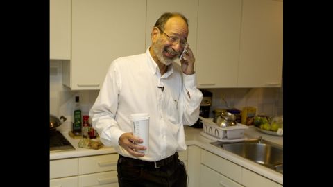 Alvin Roth receives congratulatory phone calls at his home in Menlo Park, California, on Monday, October 15, after winning the Nobel Memorial Prize in Economics, which he shared with Lloyd Shapley. Roth was "surprised" and "delighted" when he got the midnight call at his California home telling him he had won.