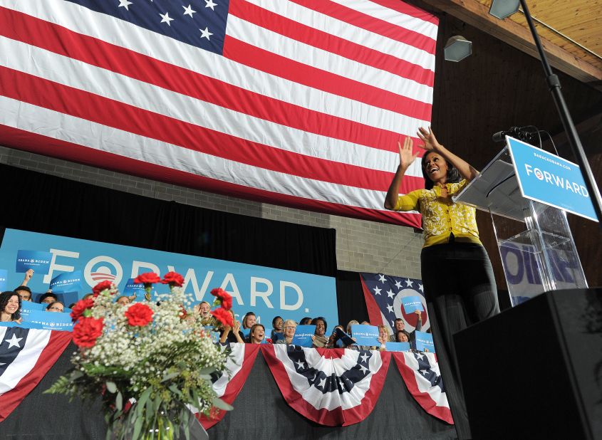 First lady Michelle Obama greets supporters during a campaign rally at Ohio Wesleyan University in Delaware, Ohio, on Monday, October 15.