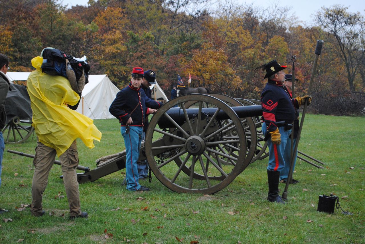 The cannon is readied by Union Artillery soldiers as the camera looks on