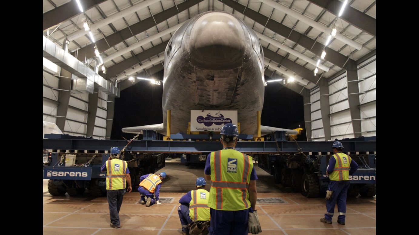 The crew carefully guides the space shuttle Endeavour into its new home at the California Science Center in Los Angeles on Sunday, October 14. Endeavour completed a 12-mile journey from Los Angeles International Airport to the science center where it will go on permanent public display.