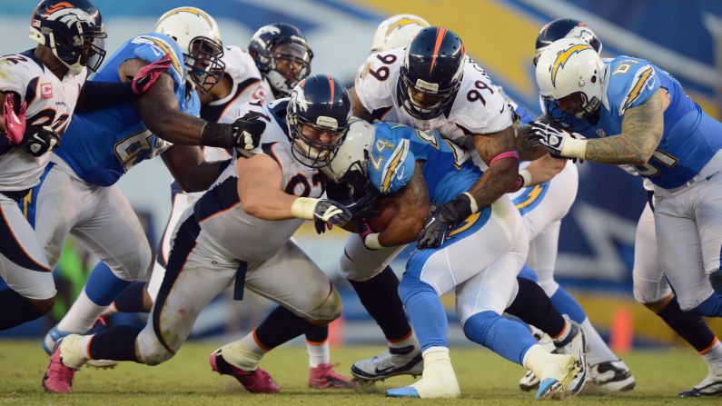 Defenders with the Broncos tackle Ryan Mathews of the Chargers.