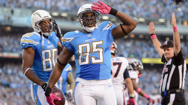 Antonio Gates of the San Diego Chargers, center, celebrates his touchdown against the Denver Broncos.