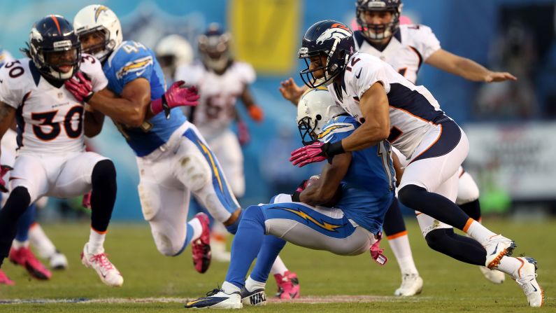 Matt Willis of the Denver Broncos, right, tackles Eddie Royal of the San Diego Chargers.