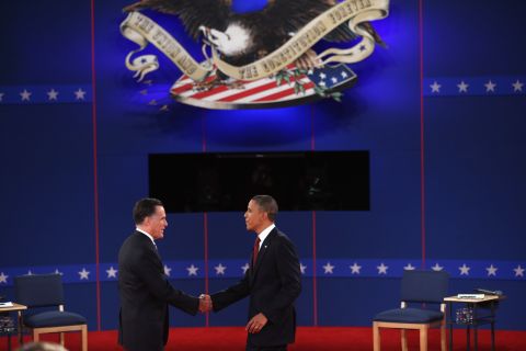 Republican presidential candidate Mitt Romney and U.S. President Barack Obama greet each other on stage.
