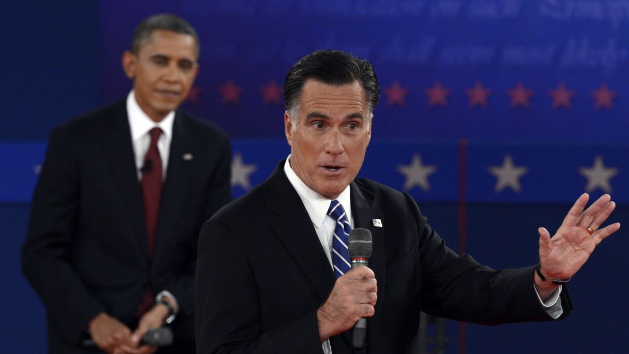 US President Barack Obama listens to the Republican Presidential candidate Mitt Romney during the second presidential debate, the only held in a townhall format, at Hofstra University in Hempstead, New York, on Tuesday, October 16.