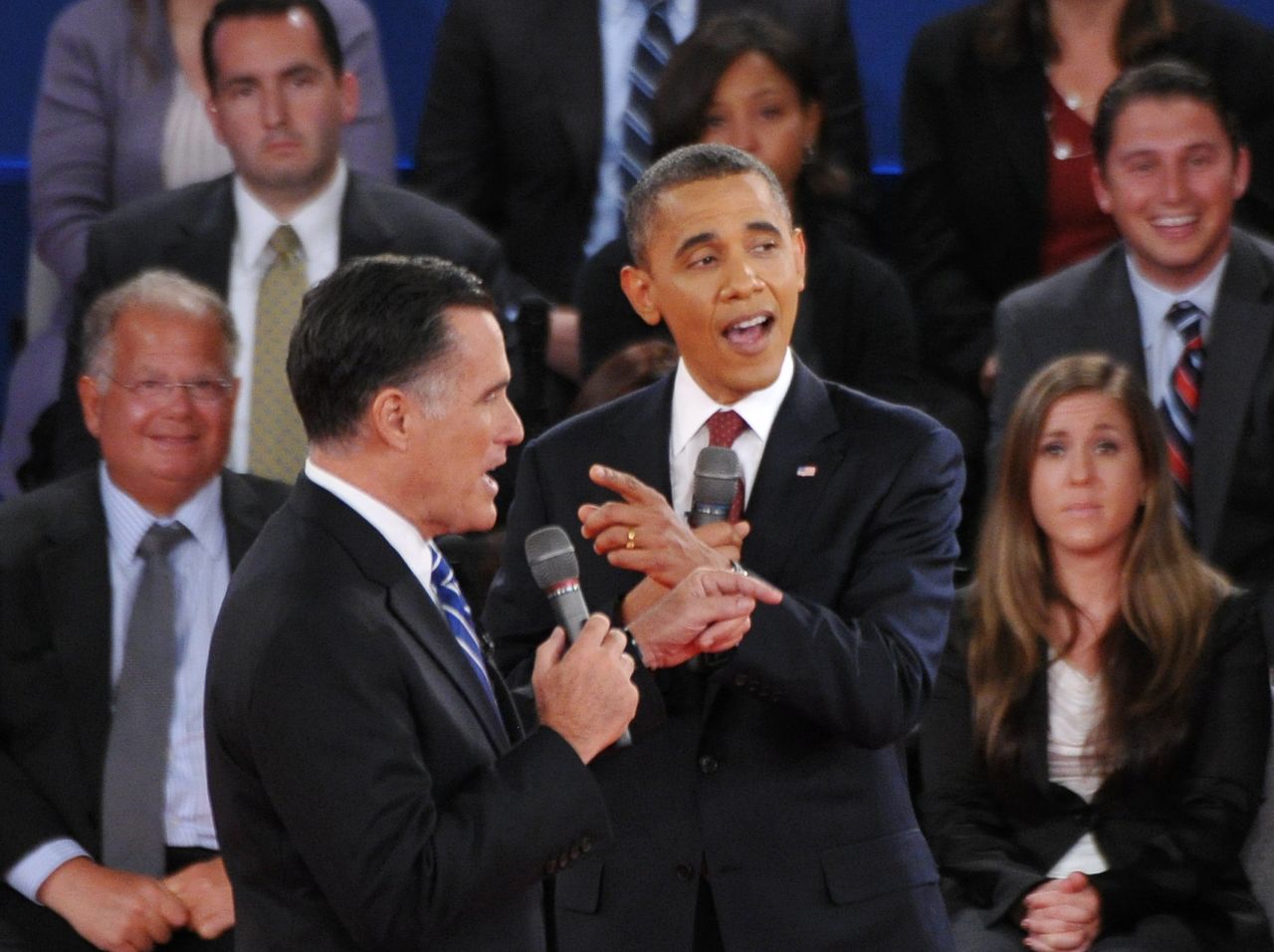 U.S. President Barack Obama and Republican presidential candidate Mitt Romney speak over each other.