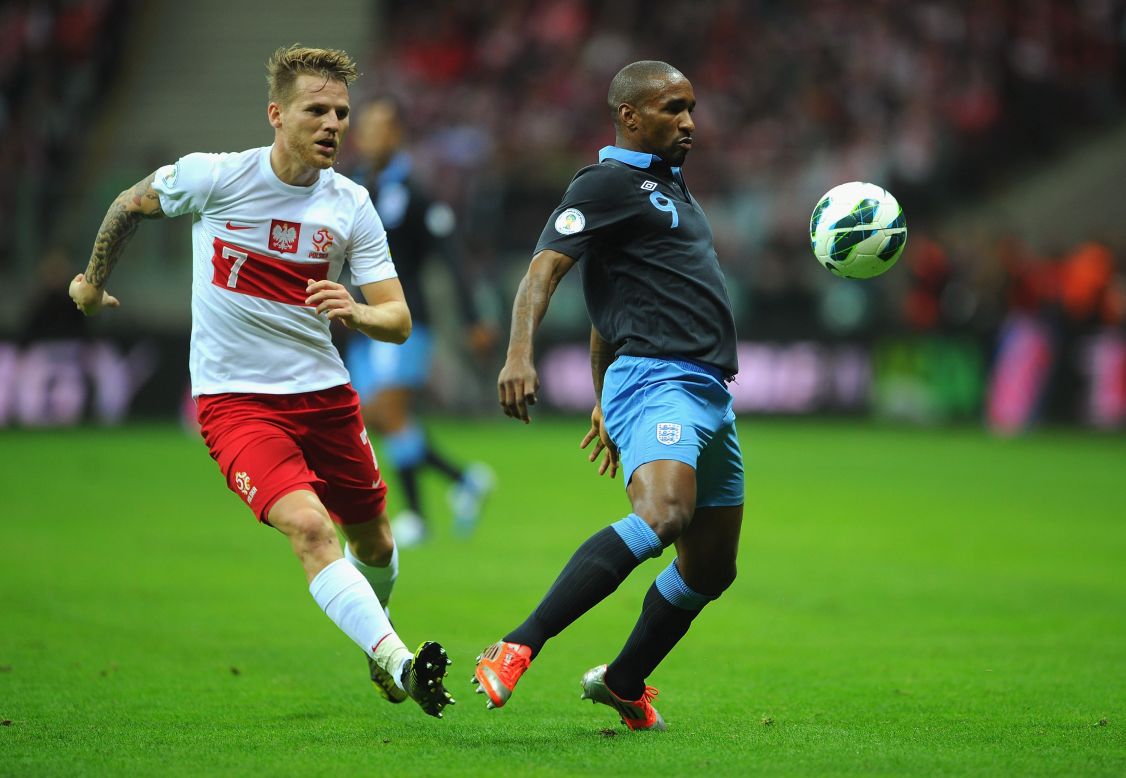 England's Jermain Defoe shields the ball from Poland's Eugen Polanski during the World Cup qualifier in Warsaw. The Tottenham striker had a glorious opportunity to extend England's lead in the second-half but failed to hit the target from close-range.